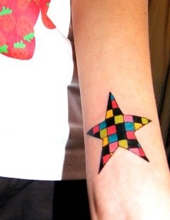 Colorful square star tattoo on arm