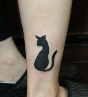 Cool black cat tattoo on leg