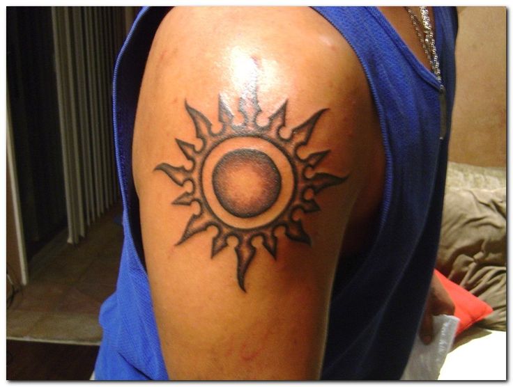 Cool men’s sun tattoo on shoulder