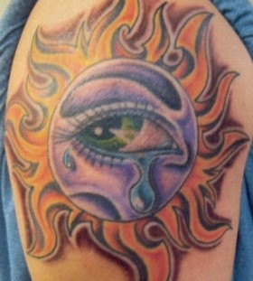Crying colorful eye tattoo on shoulder