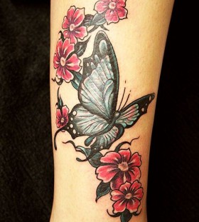Cute butterfly and flower tattoo on hand