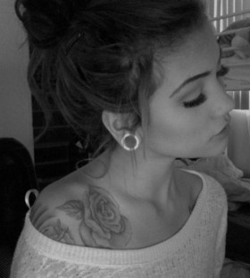 Cute girl rose tattoo on shoulder
