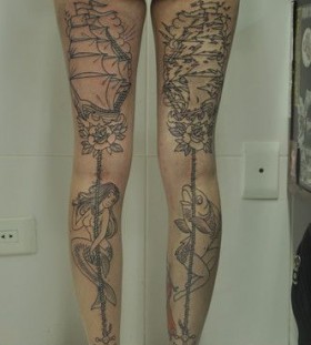 Fish, women and ship tattoo on leg