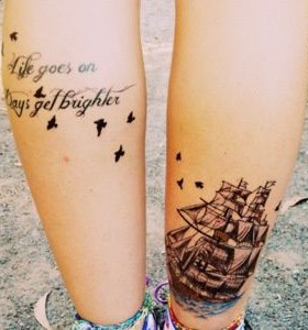 Get up ship and quote tattoo on leg