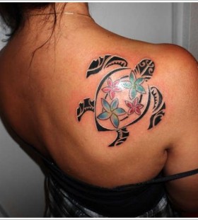 Girl with tribal turtle tattoo