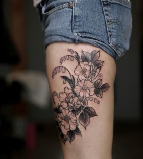 Gorgeous black flower tattoo on leg