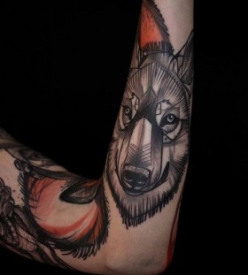 Gorgeous black wolf tattoo on arm