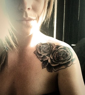 Gorgeous girl rose tattoo on shoulder