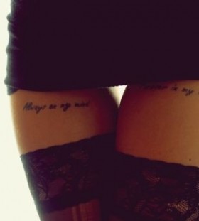 Gorgeous women's quote tattoo on leg