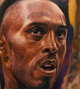 Kobe Bryant's face tattoo on leg