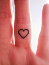 Lovely heart and love tattoo on arm