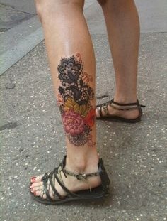 Men's flower tattoo on leg