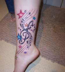 Music women star tattoo on leg
