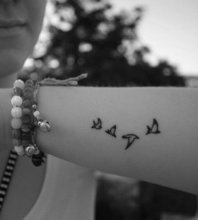 Pretty small bird tattoo