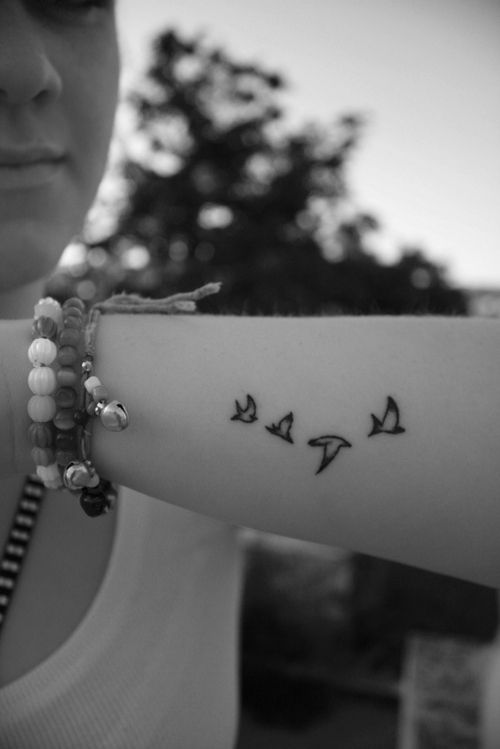 Pretty small bird tattoo
