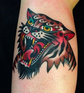 Red and brown tiger tattoo on arm