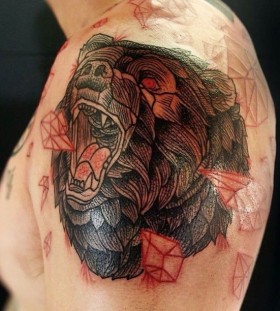 Red crystals and bear tattoo on shoulder