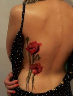 Red poppy watercolor tattoo on girl back