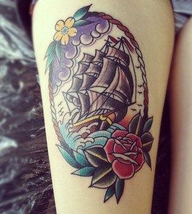 Red rose ship tattoo on leg