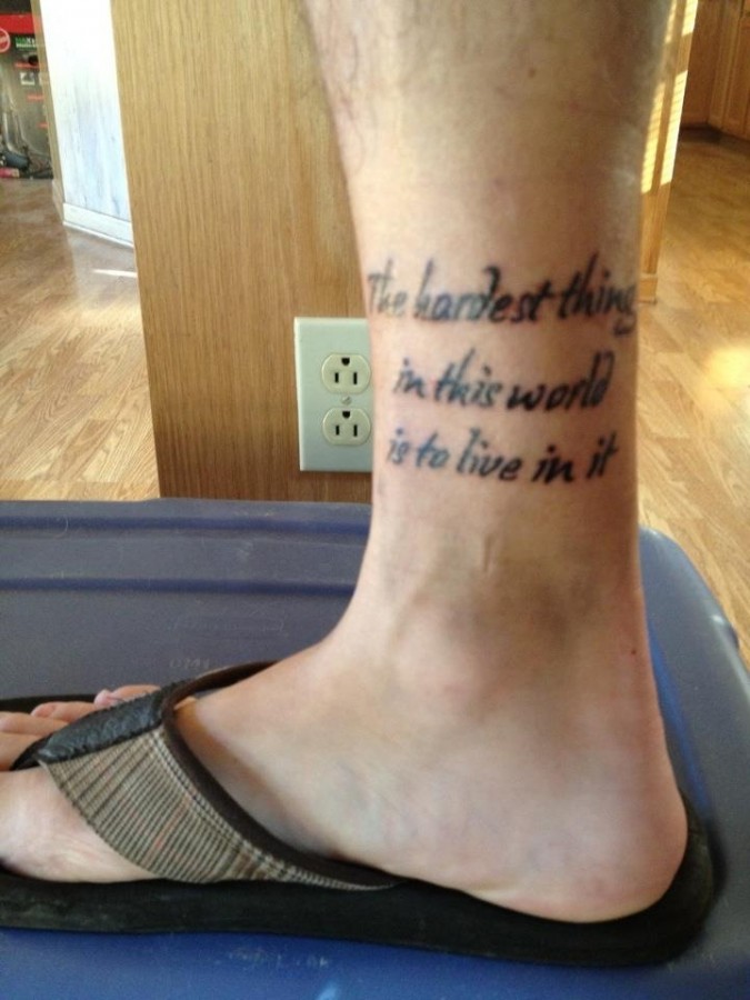 Simple words quote tattoo on leg