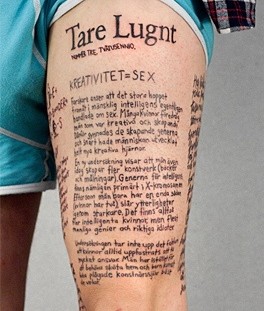 Strong men's quote tattoo on leg