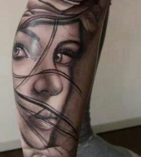 Unique women face tattoo on leg