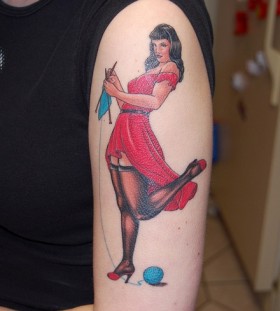 Women with red dress face tattoo on leg