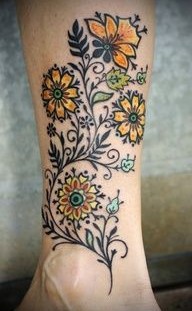 Yellow sunflowers flowers tattoo on leg