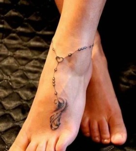 Adorable black girl tattoo on foot