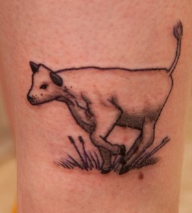 Black adorable cow tattoo