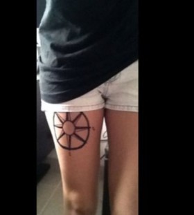 Black lovely compass tattoo on leg