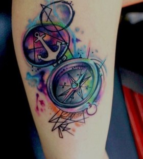 Colorful anchor compass tattoo on leg
