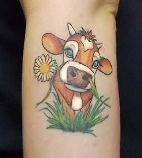 Green and yellow flower cow tattoo
