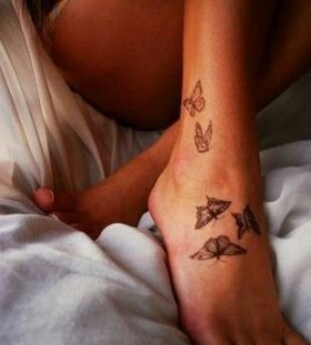 Lovely butterflies girl tattoo on foot