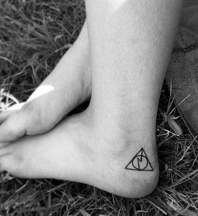 Stunning black Harry Potter tattoo