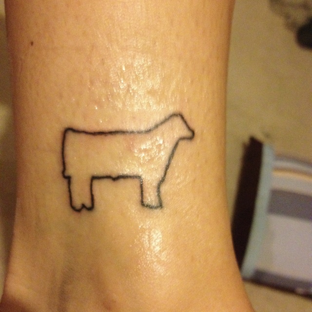 Symbol black cow tattoo