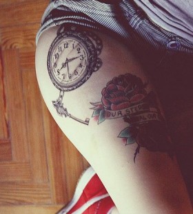 Watch and simple compass tattoo on leg