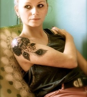 Women's shoulder black peacock tattoo