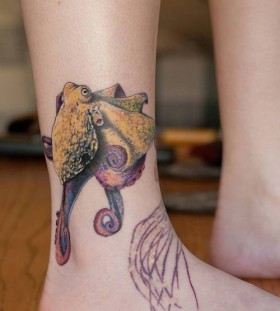 Yello, purple octopus tattoo on leg