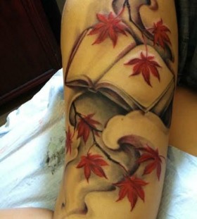 autumn leaves with book tattoo