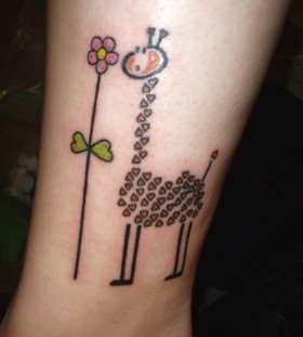 giraffe with flower tattoo on ankle