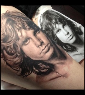 jim morrison portrait tattoo on arm