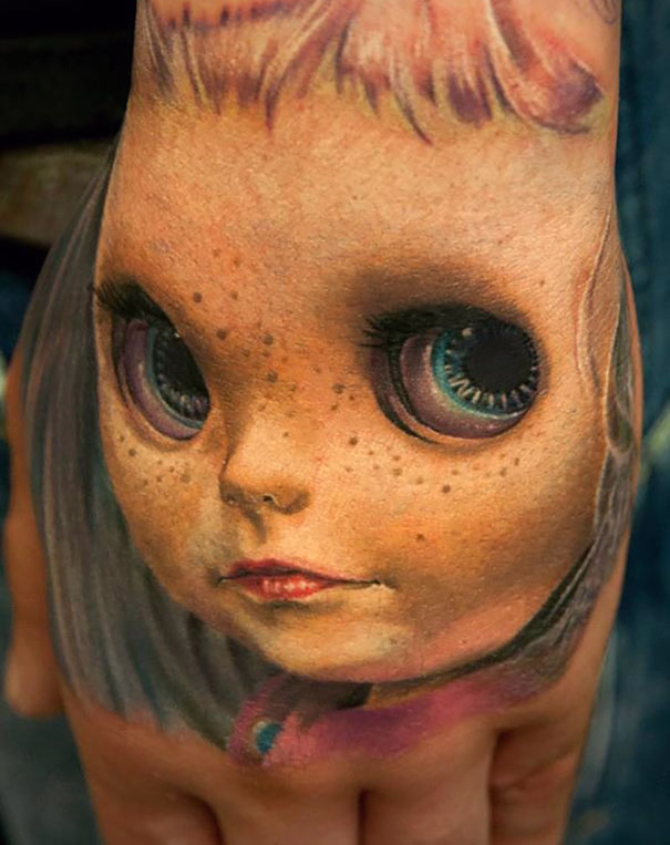 3D creepy doll on hand tattoo