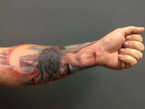 3D crussified Jesus on arm tattoo