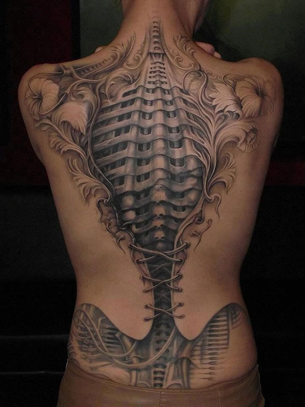 3D hidden skeleton on back tattoo