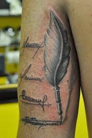Amazing feather pen tattoo