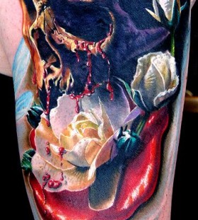 Amazing skull and flowers tattoo by Phil Garcia