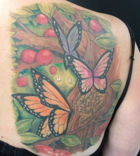 Apple tree and butterfly tattoo