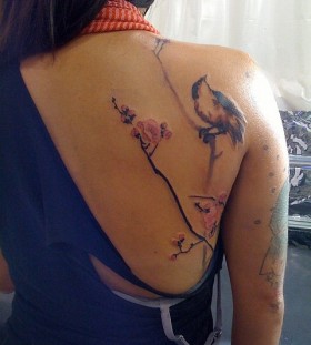 Beautiful bird on a branch tattoo by David Allen