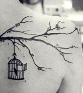 Birdcage and tree branch tattoo